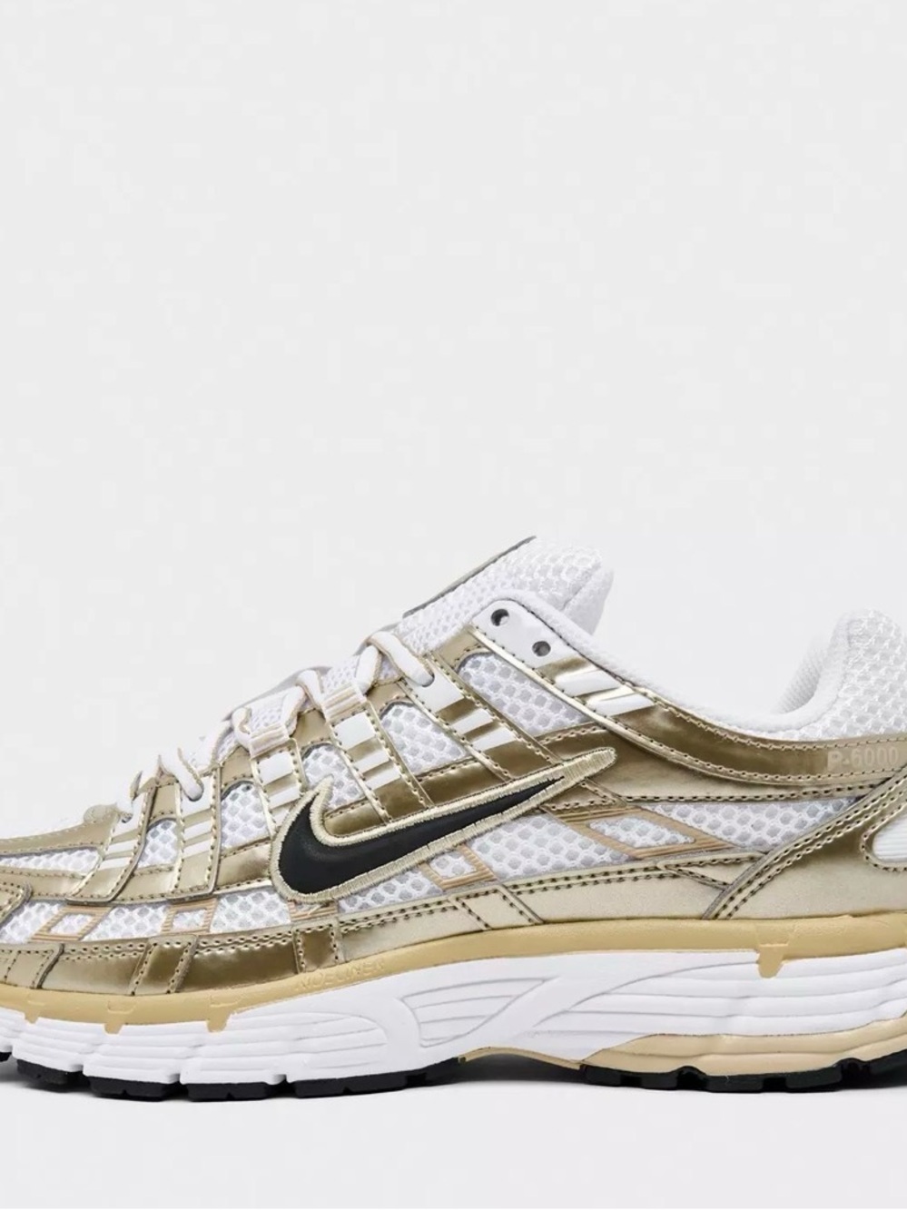 Nike White and Gold Mesh Trainer with Black Swoosh